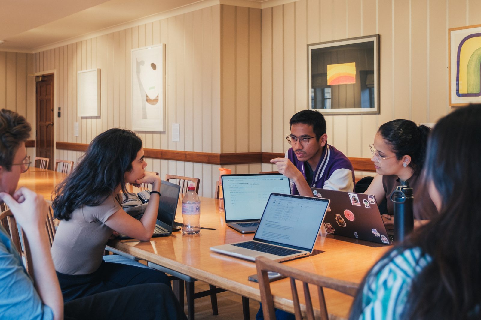 A research team working around a table at Nuffield College