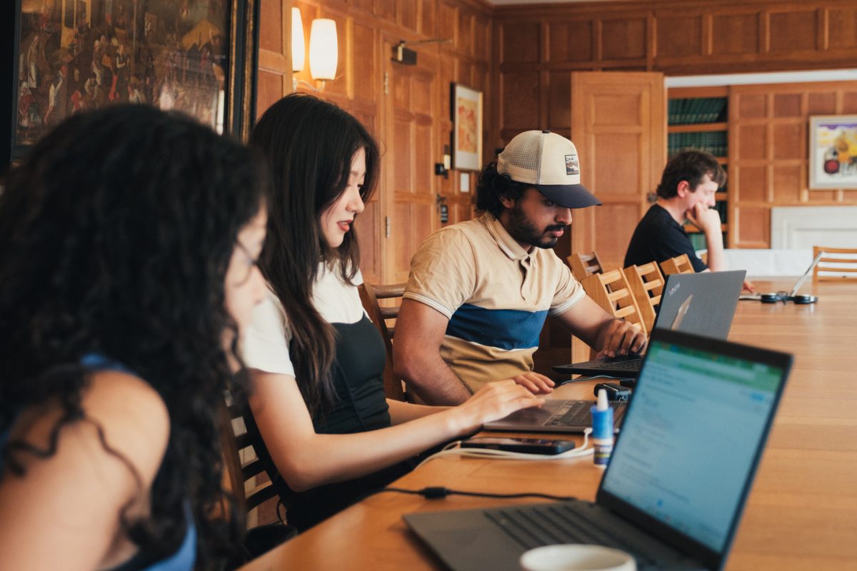 Participants writing code together during a research session